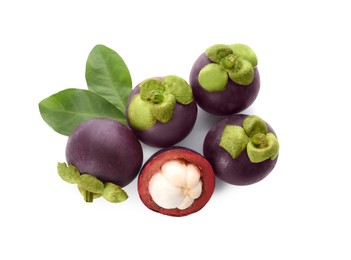 Fresh mangosteen fruits with green leaves on white background, top view