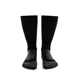 Photo of Woman wearing thermal socks on white background, closeup of legs. Winter sport clothes