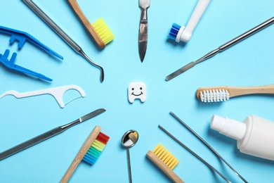 Flat lay composition with items for mouth and teeth care on color background