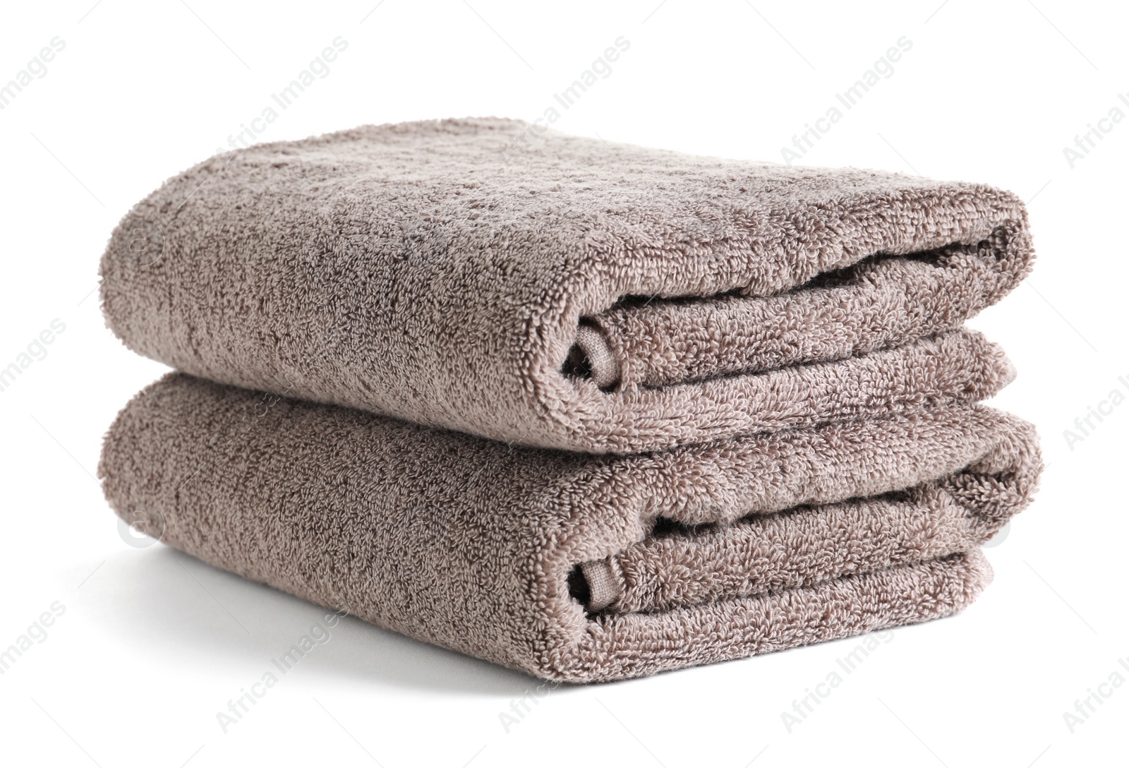 Photo of Fresh soft folded towels isolated on white