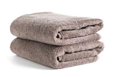 Photo of Fresh soft folded towels isolated on white