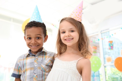 Cute little children at birthday party indoors