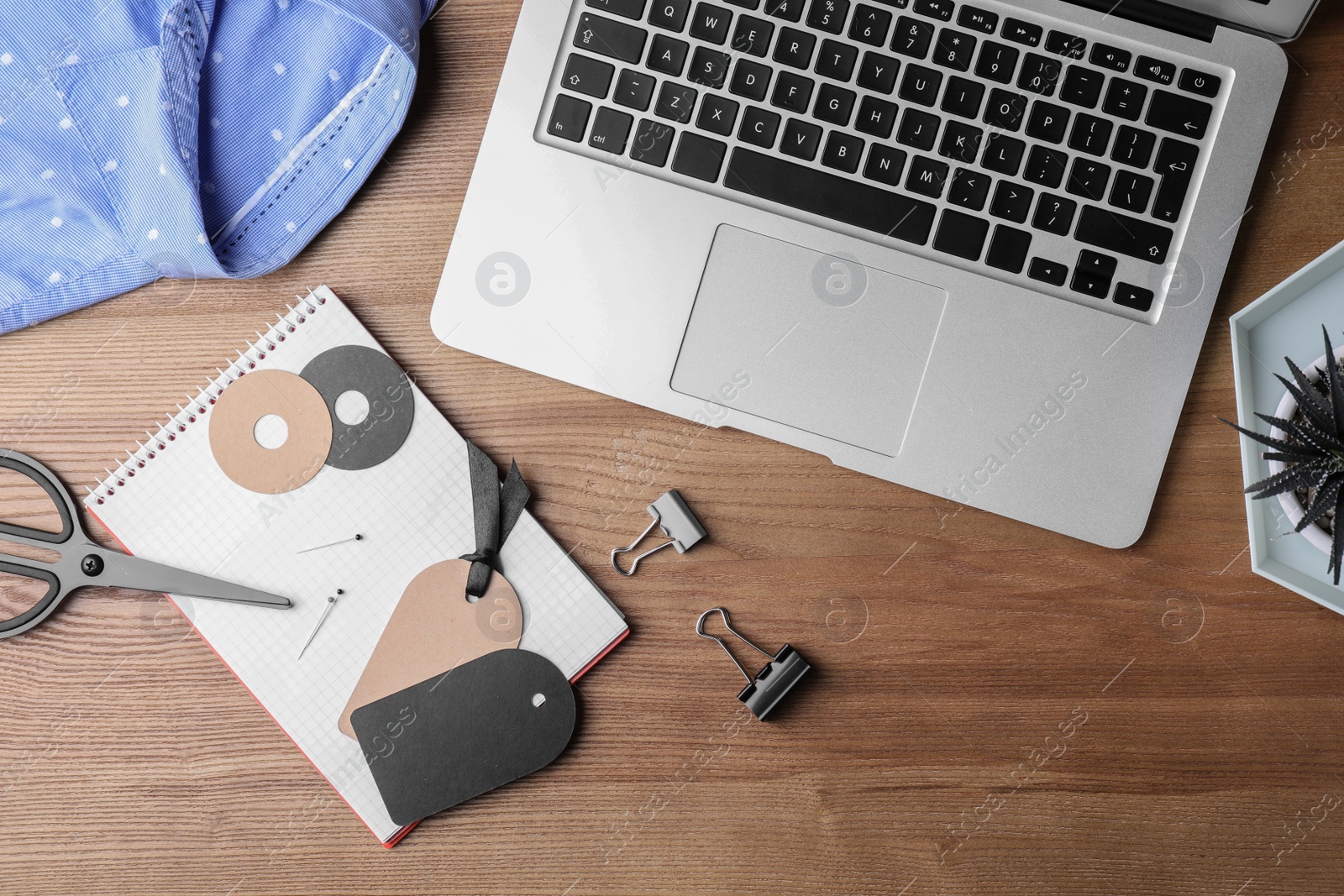 Photo of Flat lay composition with laptop on wooden background. Blogger's workplace