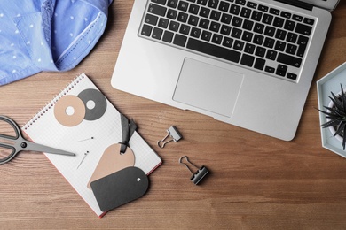 Flat lay composition with laptop on wooden background. Blogger's workplace