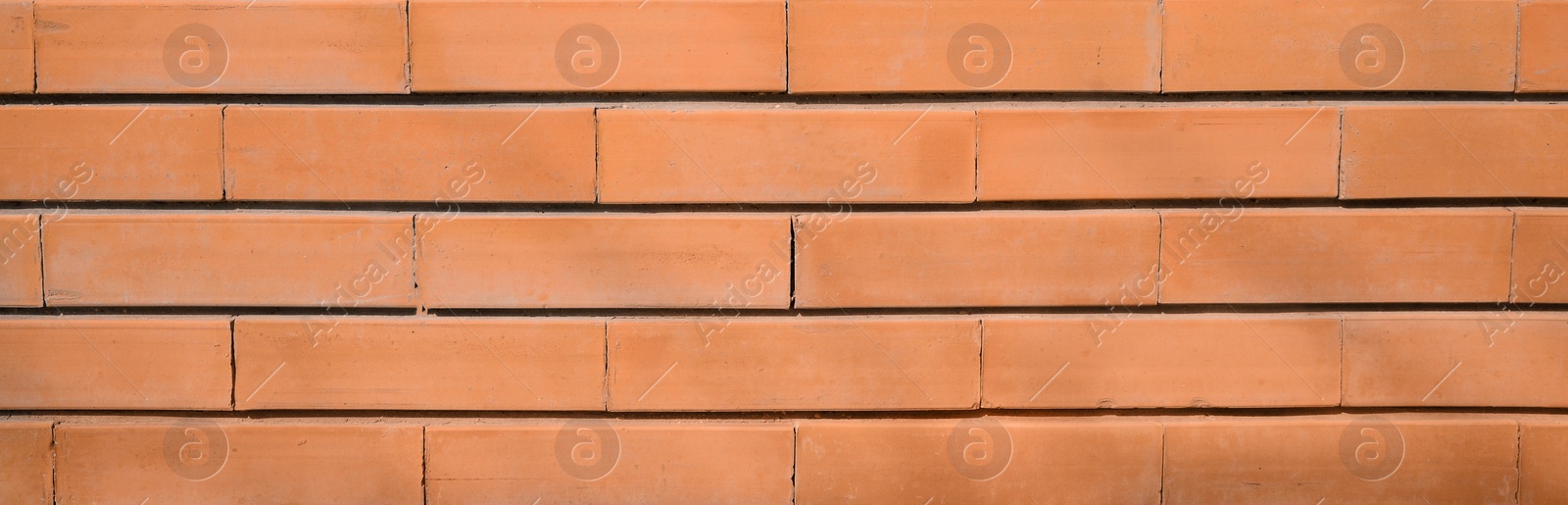 Image of Orange brick wall as background. Banner design