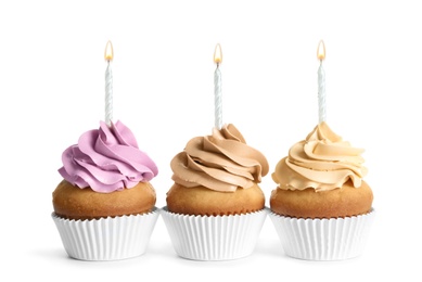 Photo of Delicious birthday cupcakes with candles on white background