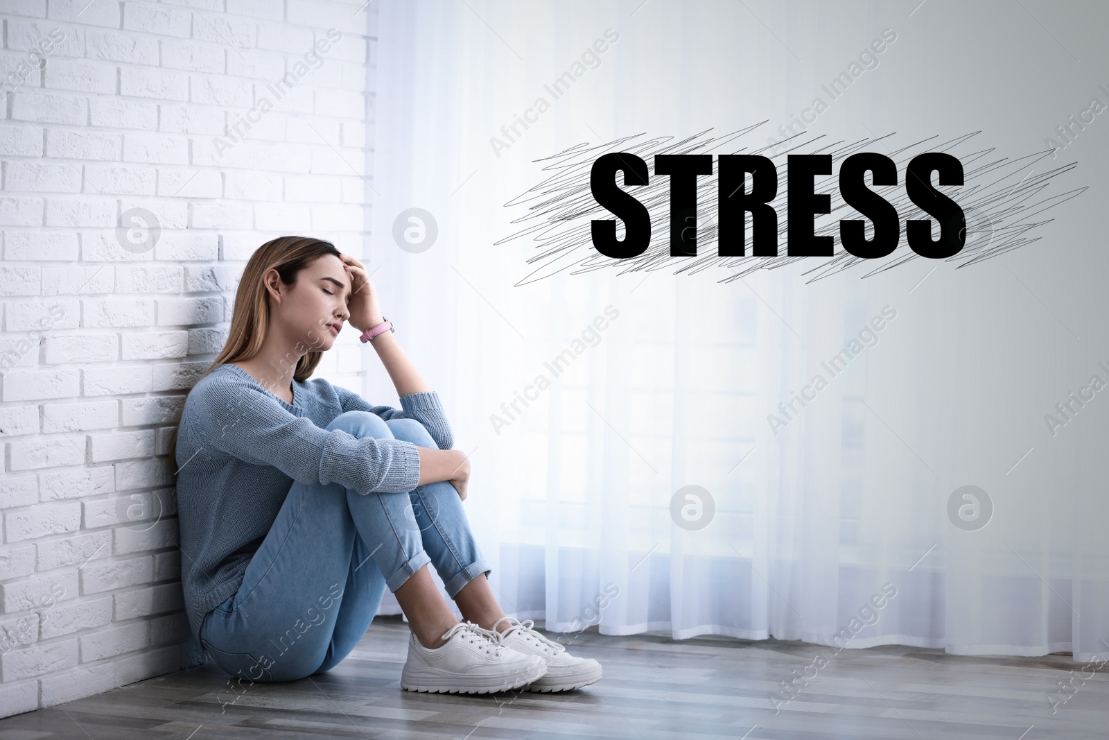 Image of Depressed young girl sitting on floor indoors and word STRESS