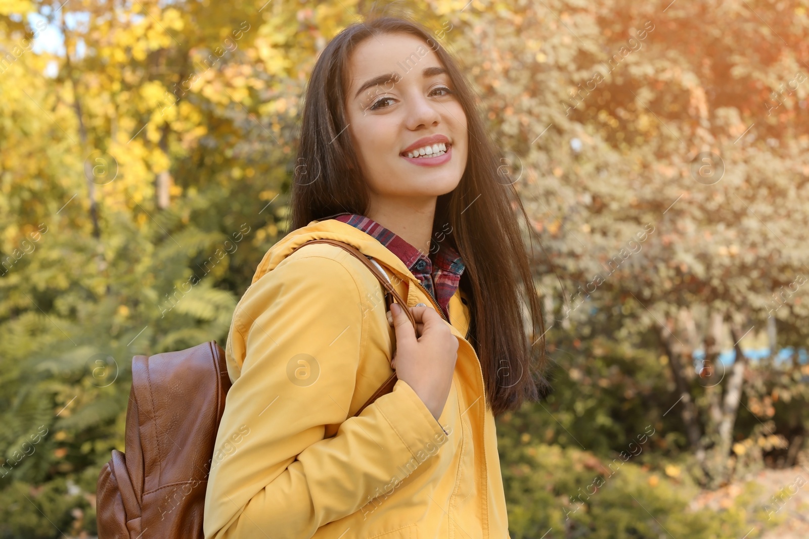 Photo of Portrait of young beautiful woman in park. Autumn walk