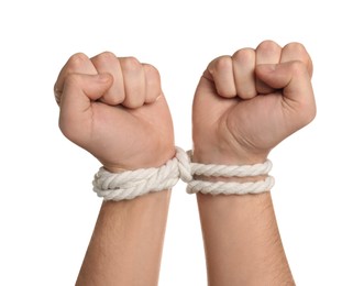 Photo of Freedom concept. Man with tied arms on white background, closeup