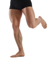 Photo of Man with muscular legs on white background, closeup