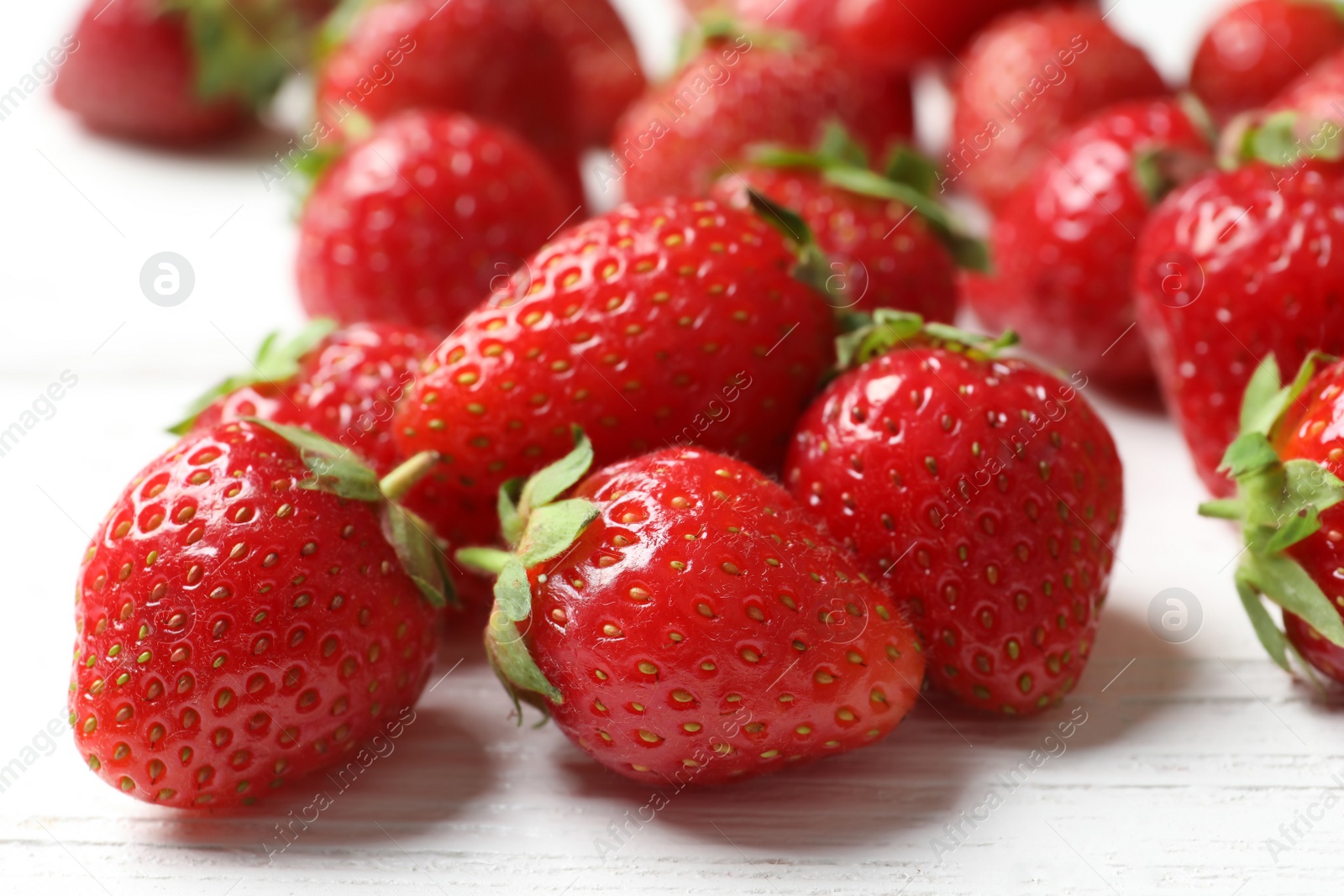 Photo of Ripe red strawberries on light background, closeup