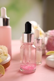 Photo of Composition with spa cosmetic on pink wooden table, closeup