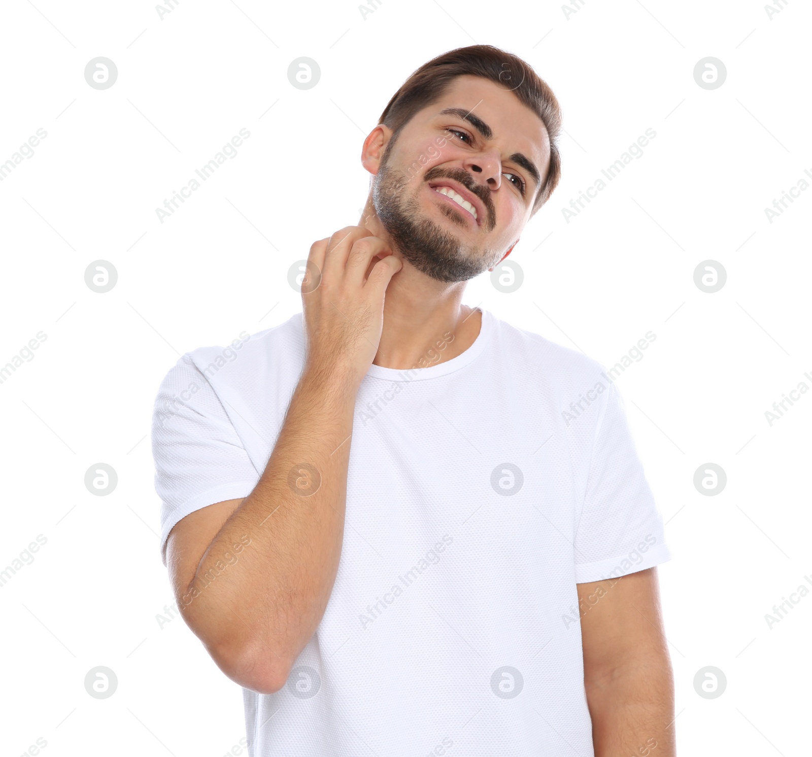 Photo of Young man scratching neck on white background. Annoying itch