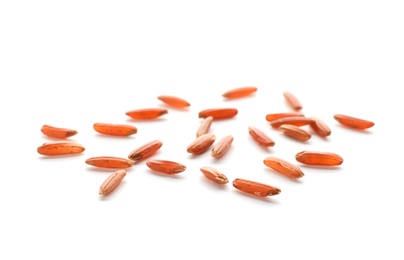 Photo of Scattered grains of brown rice on white background