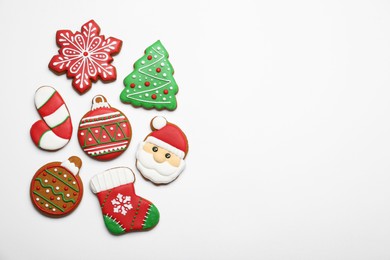 Photo of Different tasty Christmas cookies on white background, flat lay. Space for text