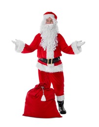 Photo of Man in Santa Claus costume with bag posing on white background