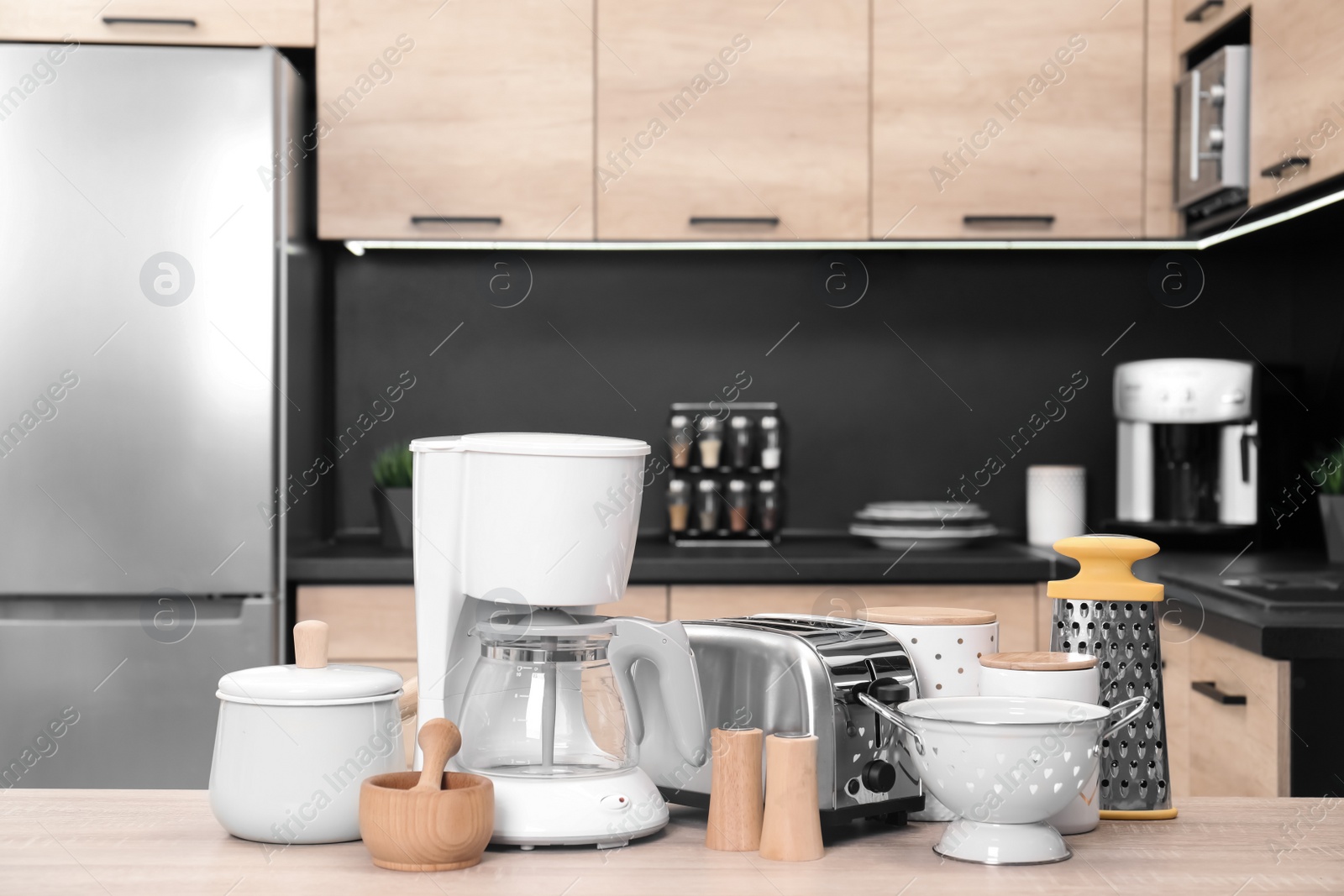 Photo of Set with modern domestic appliances in kitchen