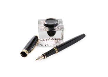 Photo of Stylish black fountain pen and inkwell isolated on white