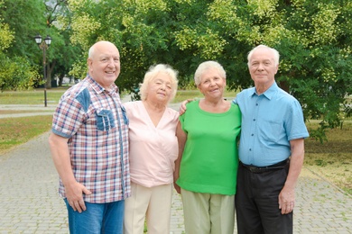 Photo of Elderly people spending time together in park