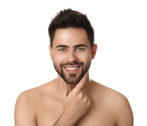 Handsome young man with beard after shaving on white background