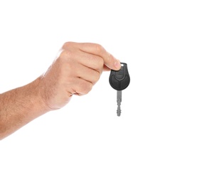 Man holding car key on white background, closeup. Getting driving license