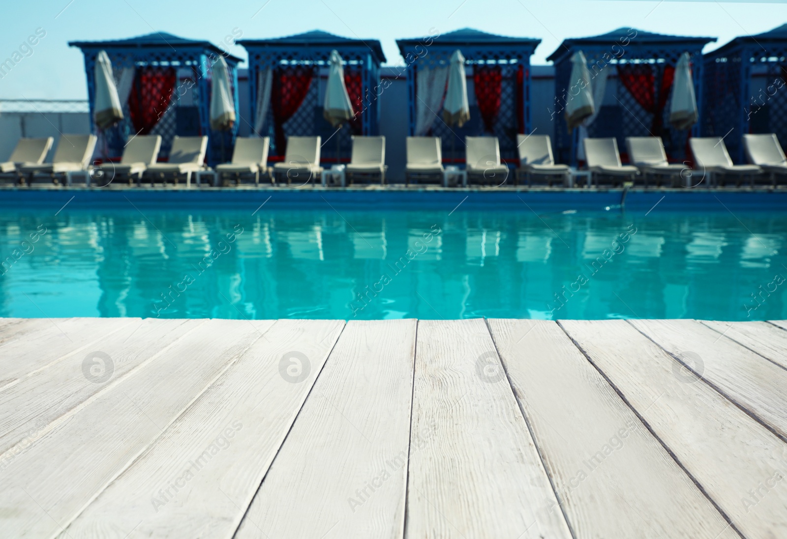 Photo of Modern swimming pool outdoors on sunny day. Space for text