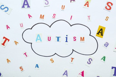 Photo of Flat lay composition with word Autism on white background