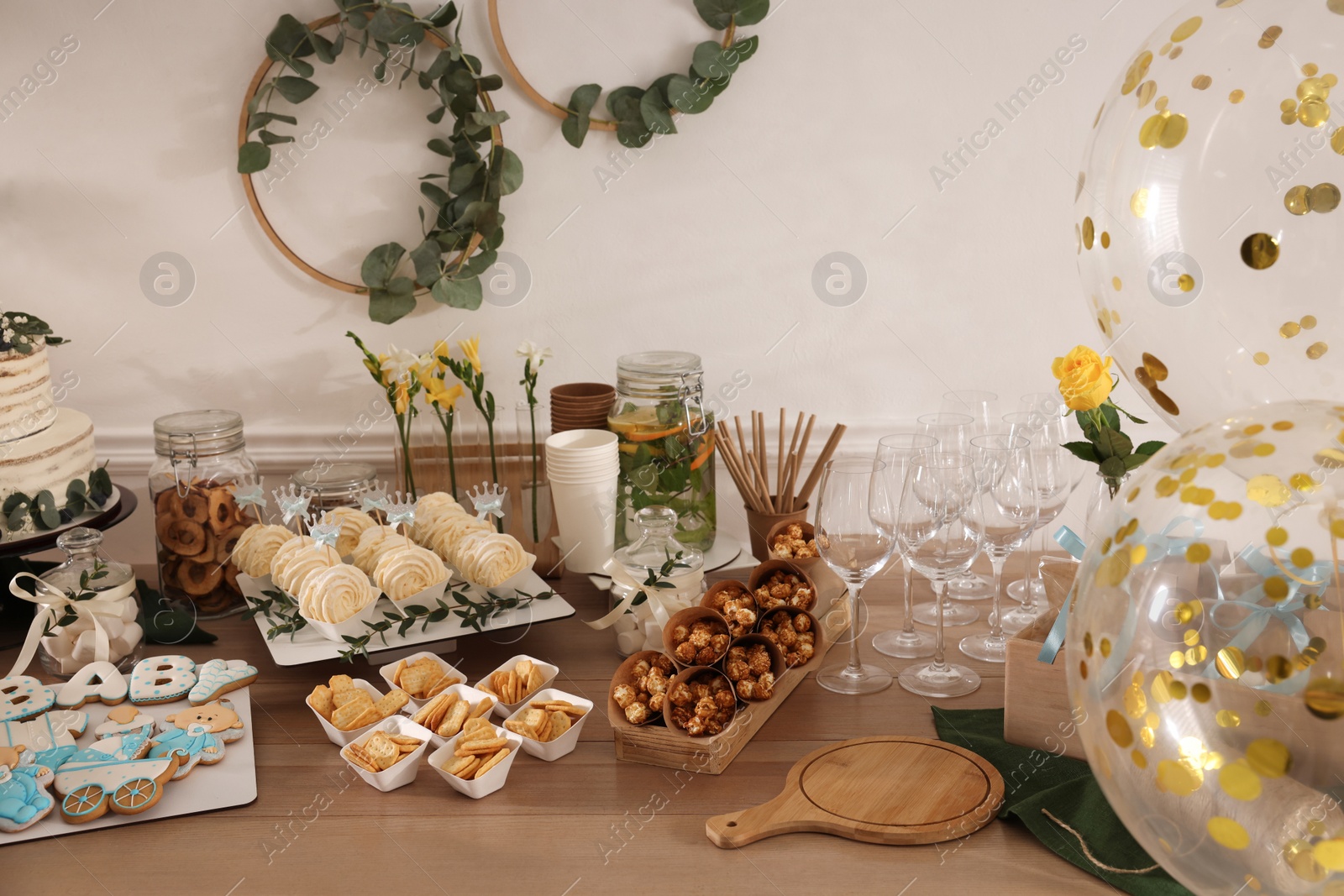 Photo of Tasty treats on table in room. Baby shower party