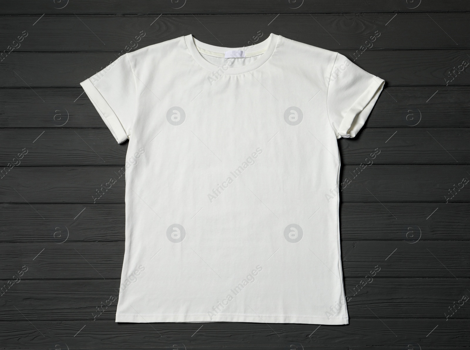 Photo of Stylish white T-shirt on gray wooden table, top view