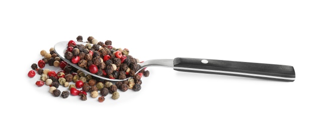 Photo of Spoon of mixed peppercorns isolated on white