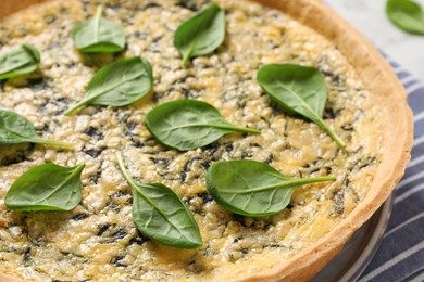 Photo of Delicious homemade spinach pie on table, closeup