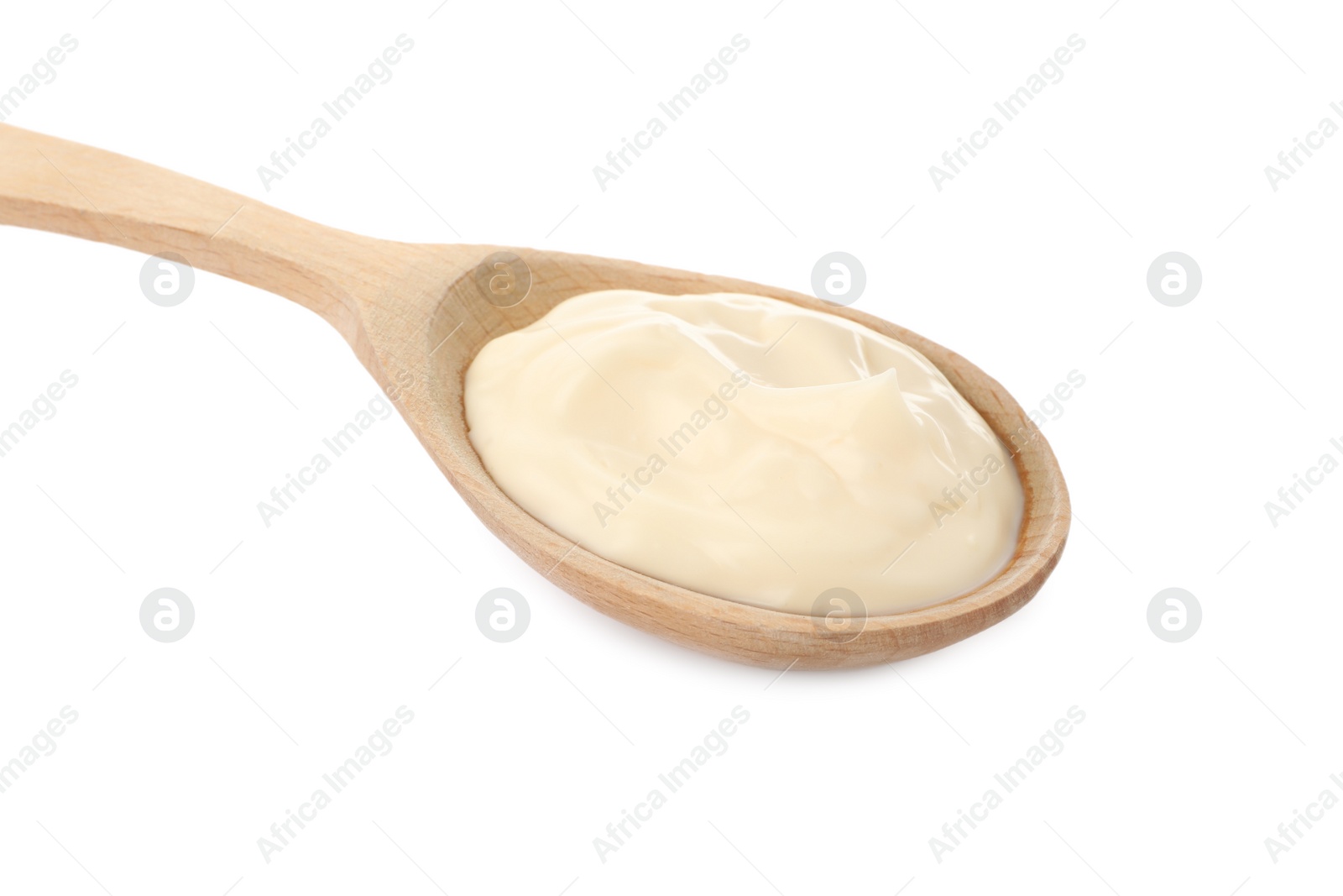 Photo of Wooden spoon with mayonnaise isolated on white