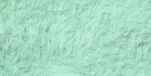 Texture of soft turquoise fabric as background, top view