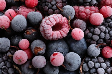 Photo of Mix of different frozen berries as background, top view