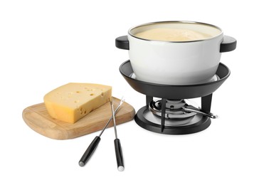 Fondue with tasty melted cheese, forks and piece isolated on white