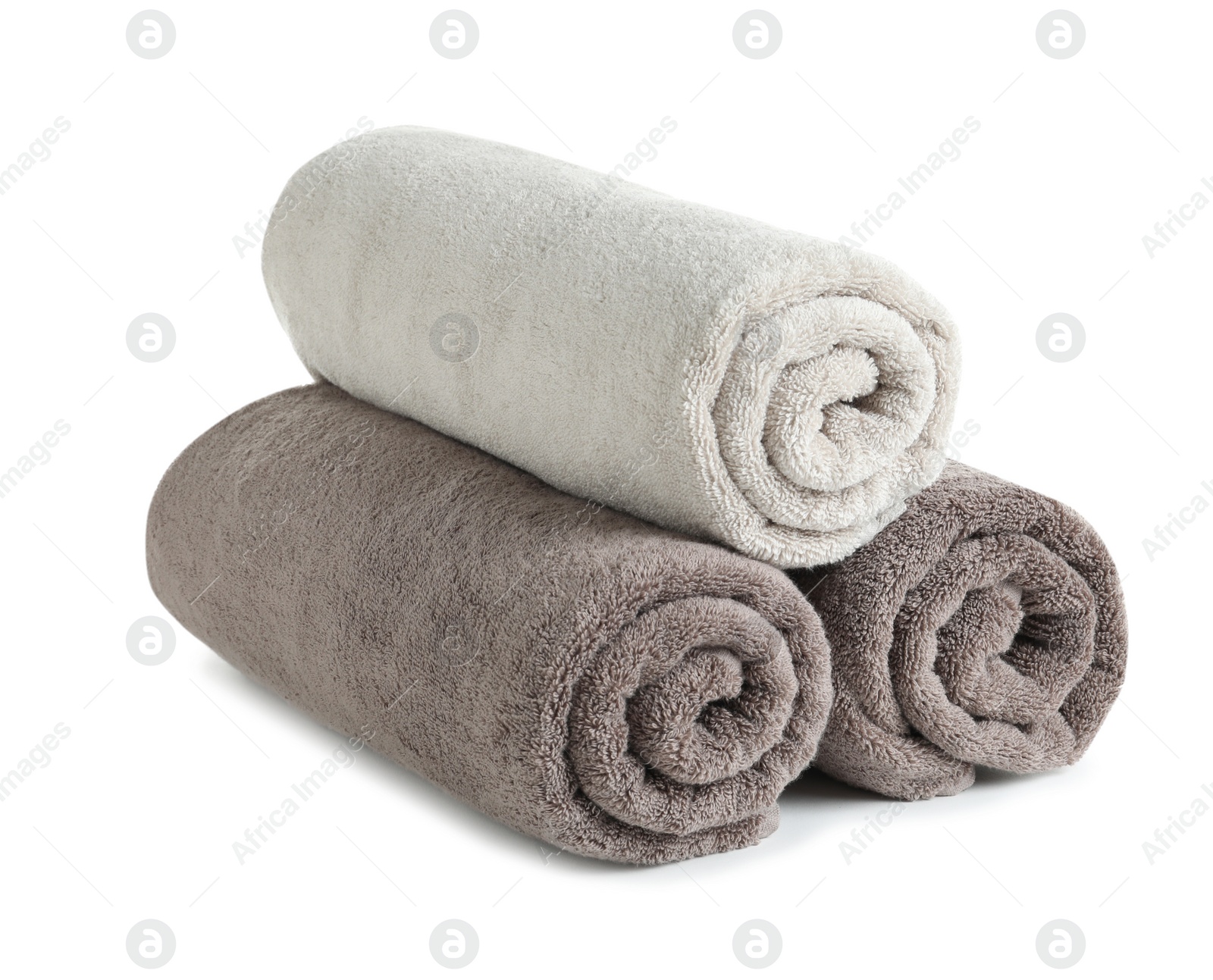 Photo of Fresh soft rolled towels isolated on white