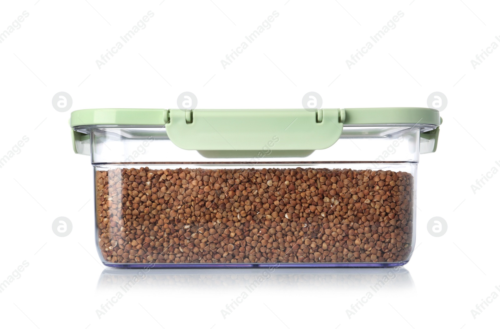 Photo of Box with uncooked buckwheat on white background