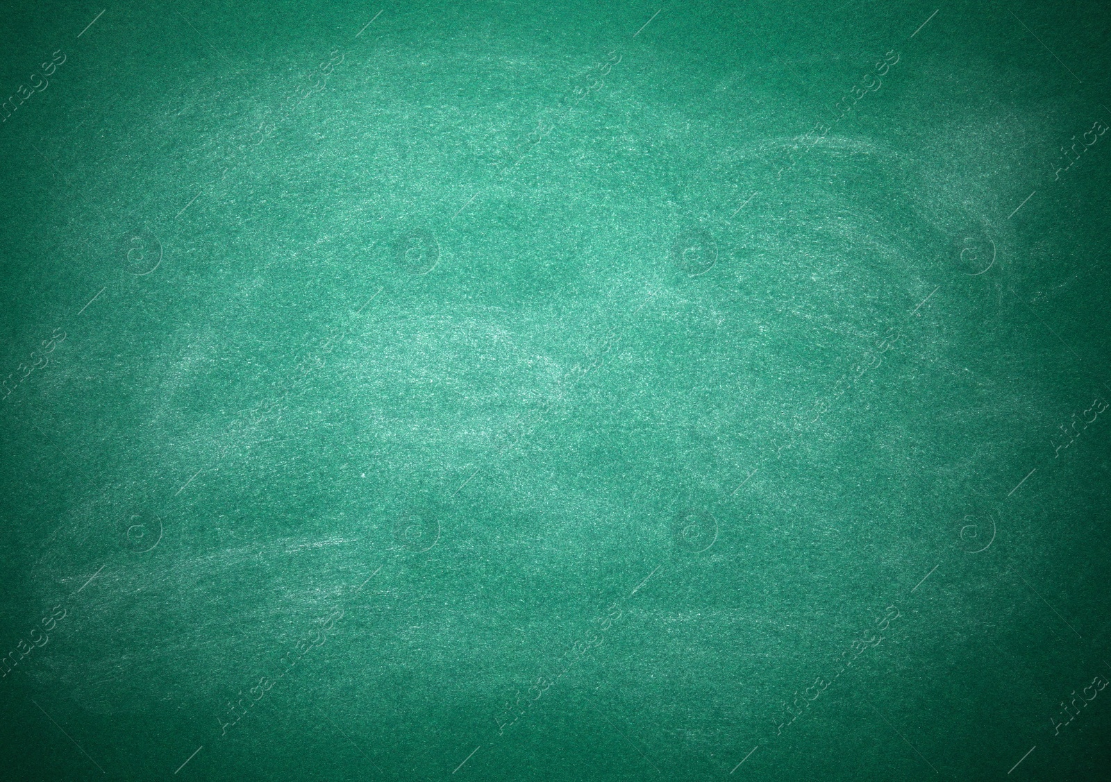 Photo of Chalk rubbed out on green board as background. Space for text