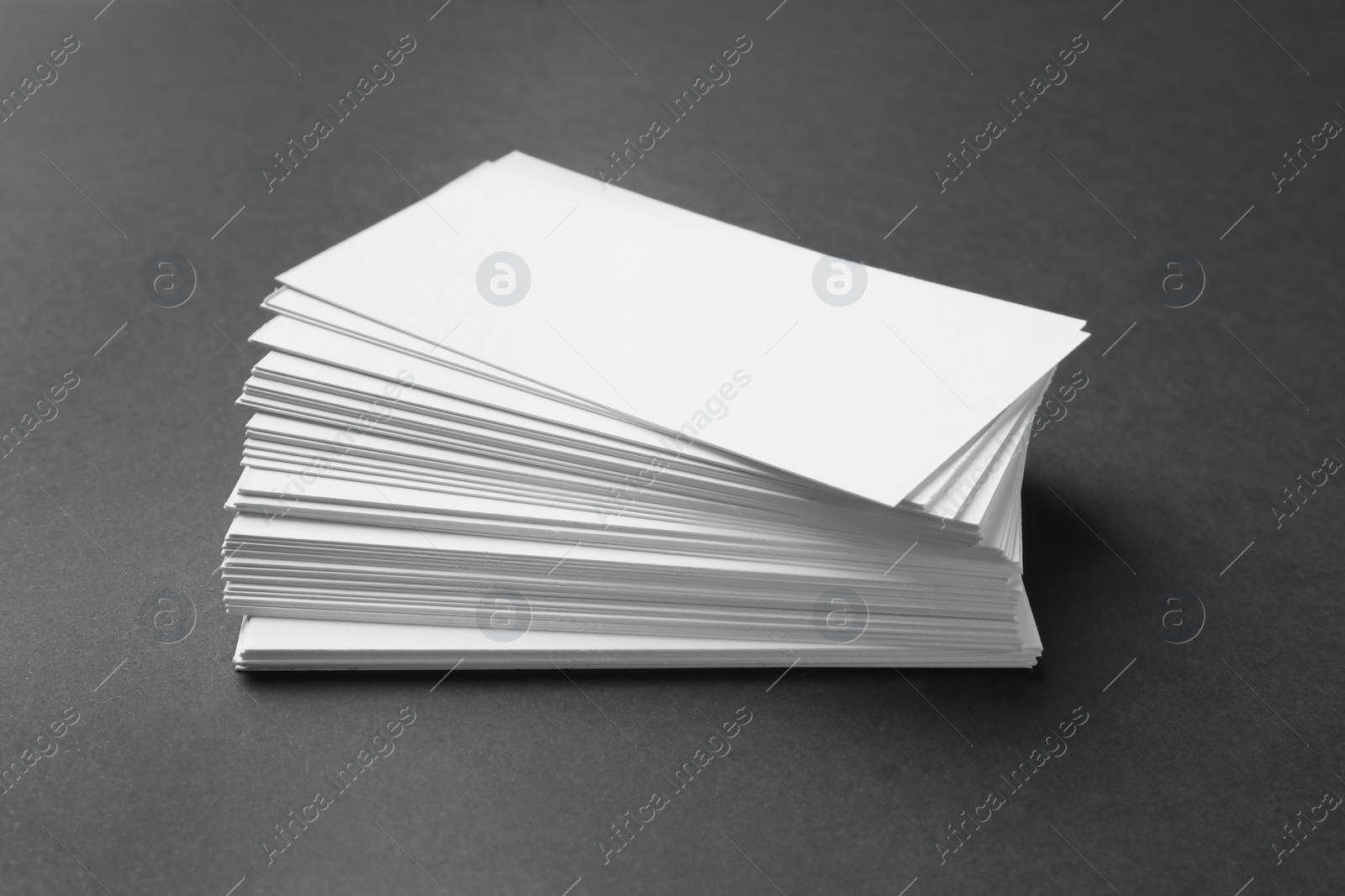 Photo of Blank business cards on dark grey background. Mockup for design