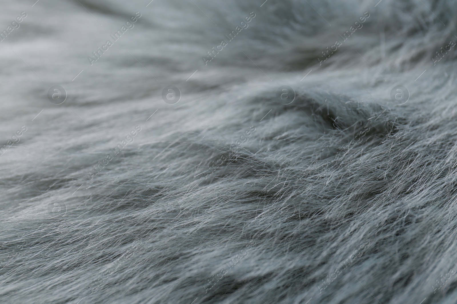 Photo of Grey faux fur as background, closeup view