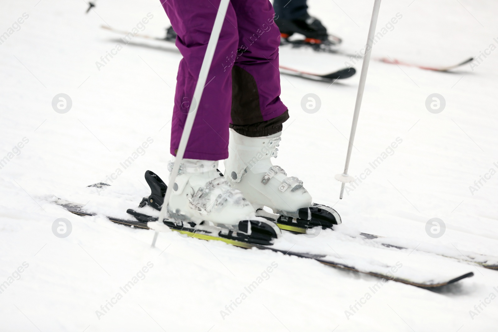 Photo of Skier on slope at resort, closeup. Winter vacation