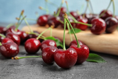 Photo of Sweet red cherries on table