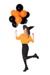 Photo of Beautiful woman wearing witch costume with balloons for Halloween party on white background