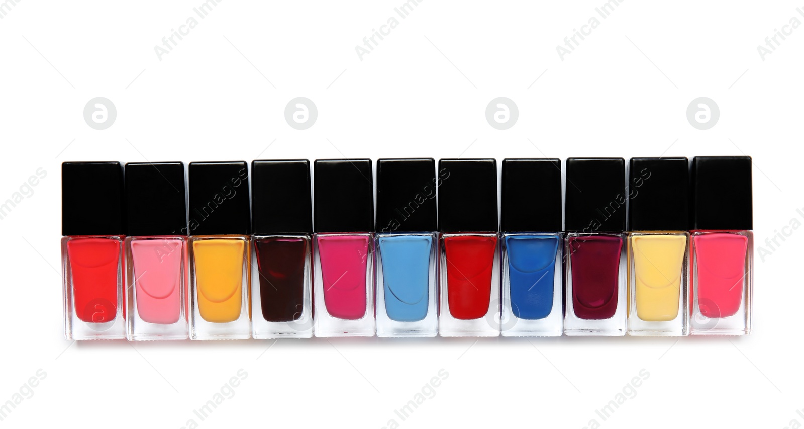 Photo of Bottles of nail polish on white background, top view