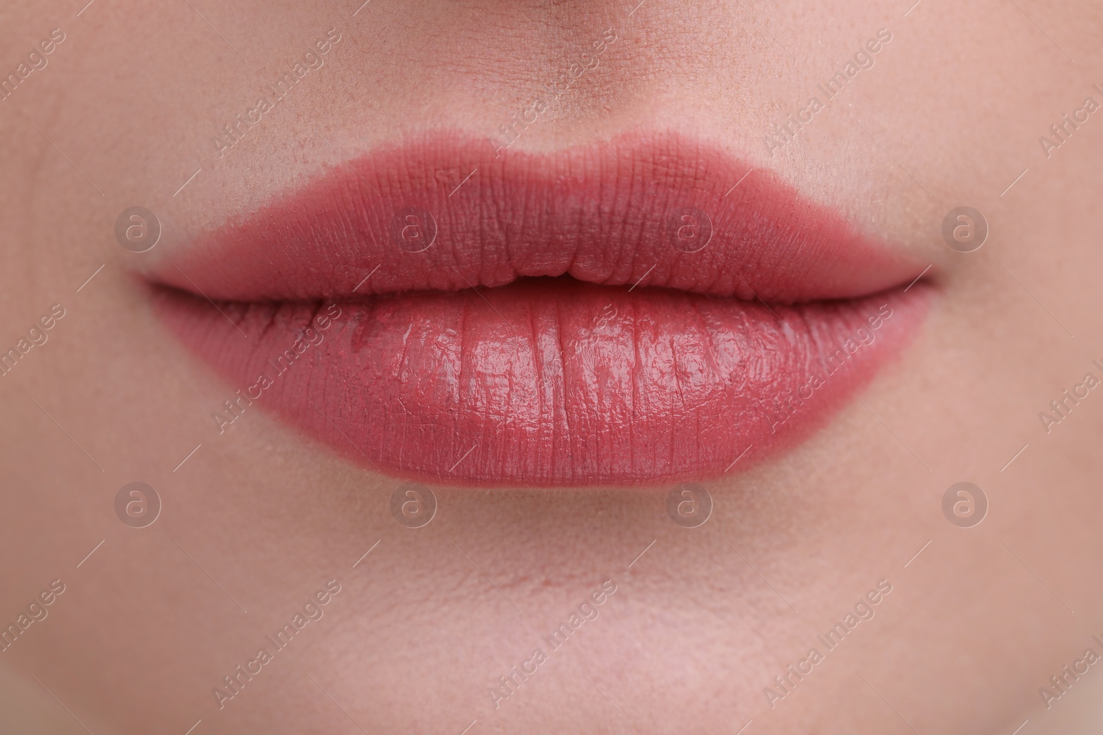 Photo of Young woman with beautiful full lips as background, closeup