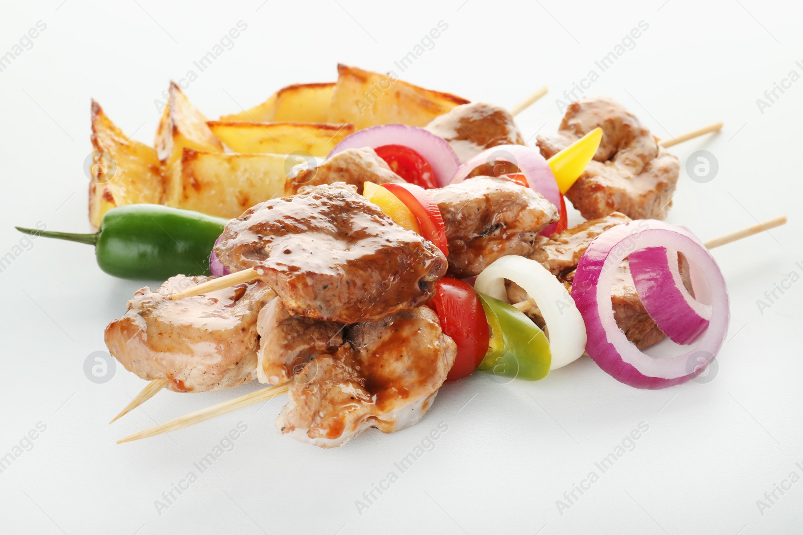 Photo of Delicious fried meat with garnish on white background