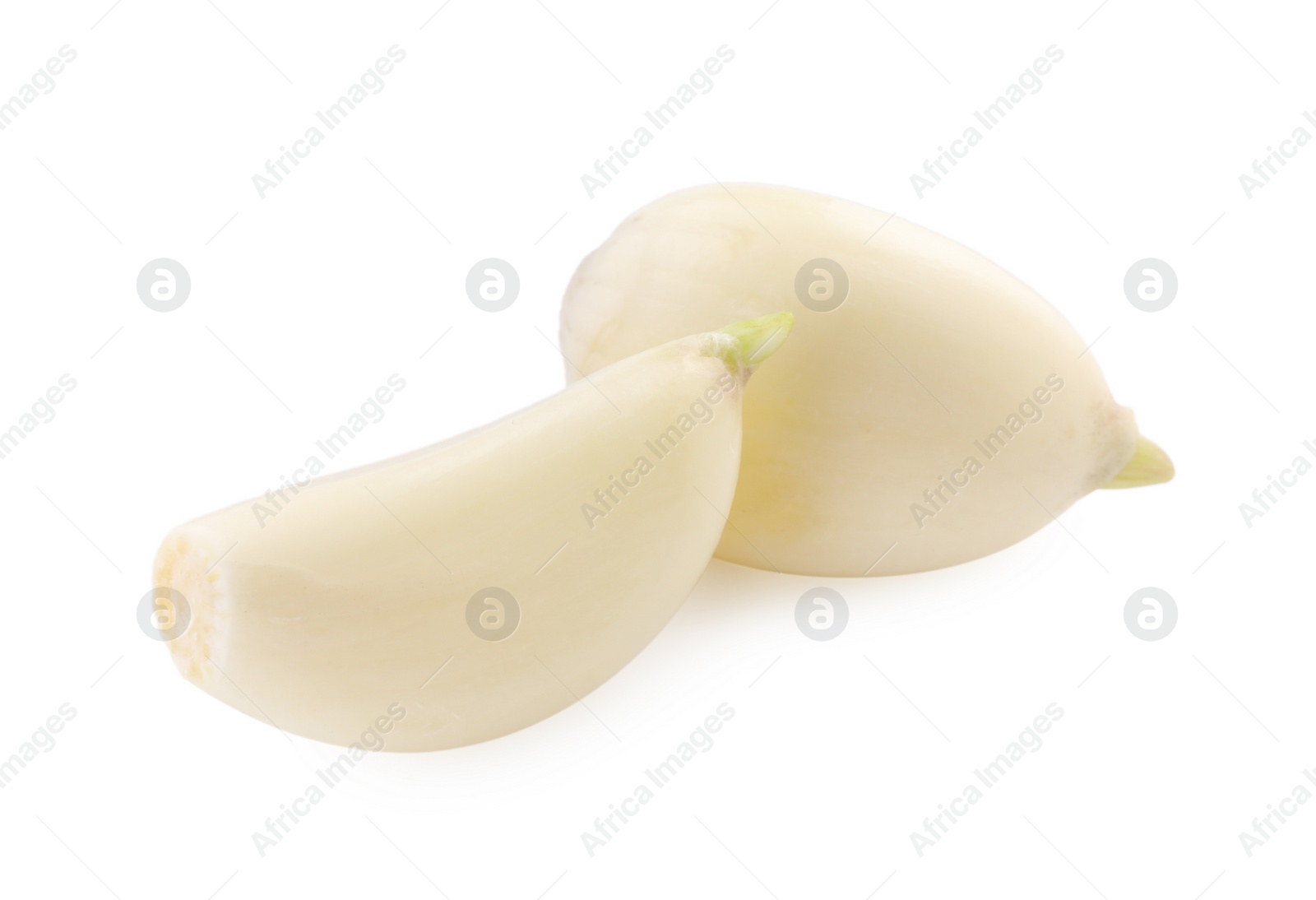 Photo of Peeled cloves of garlic isolated on white