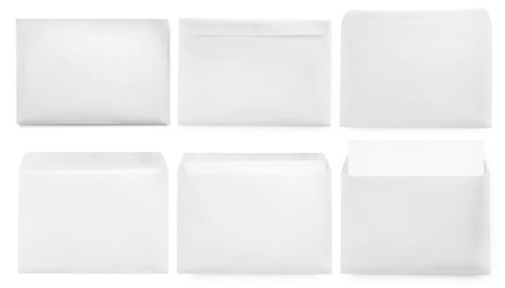 Image of Set with blank paper envelopes on white background