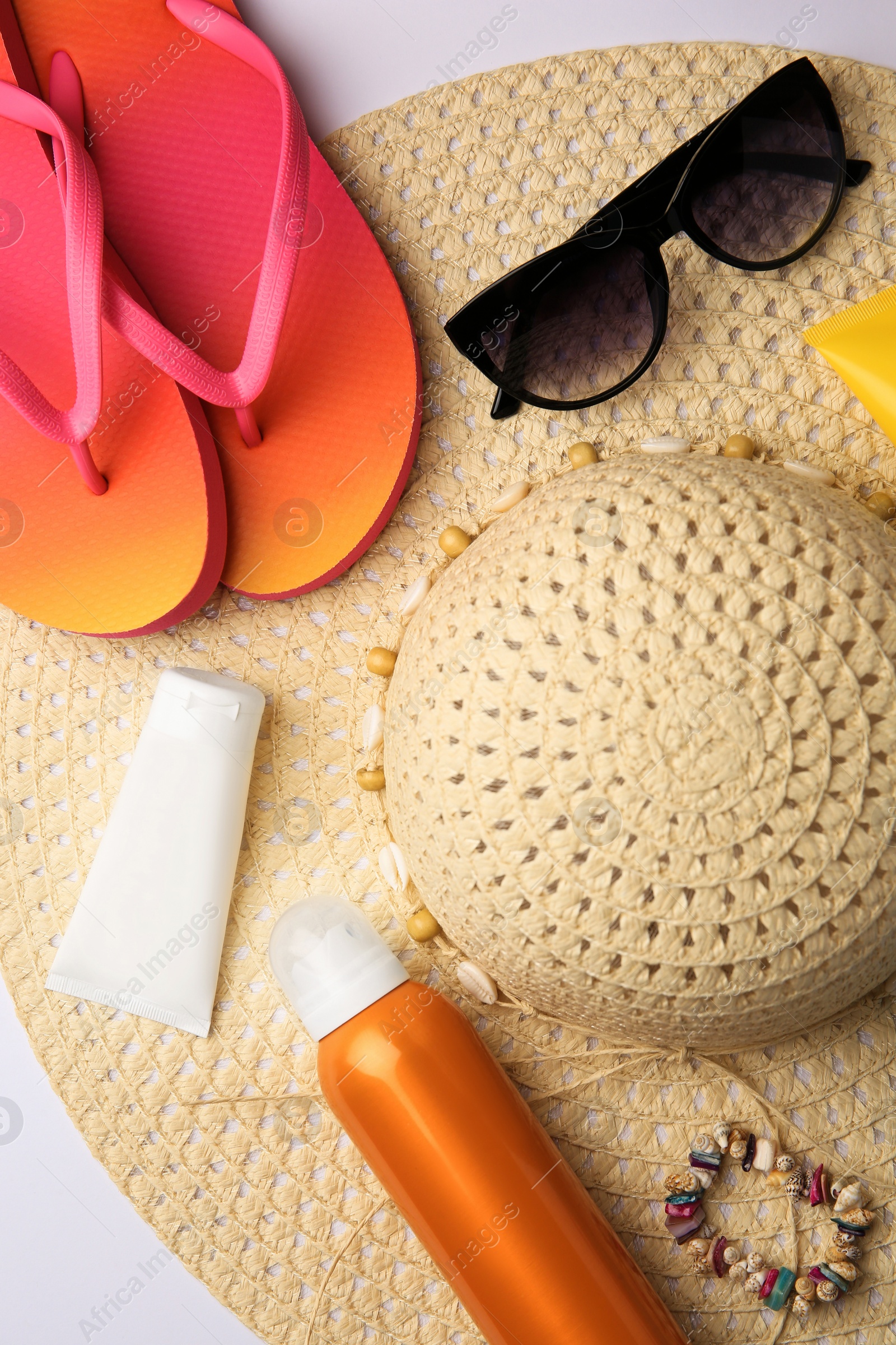 Photo of Flat lay composition with beach accessories on white background