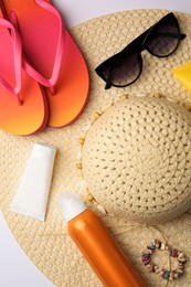 Flat lay composition with beach accessories on white background